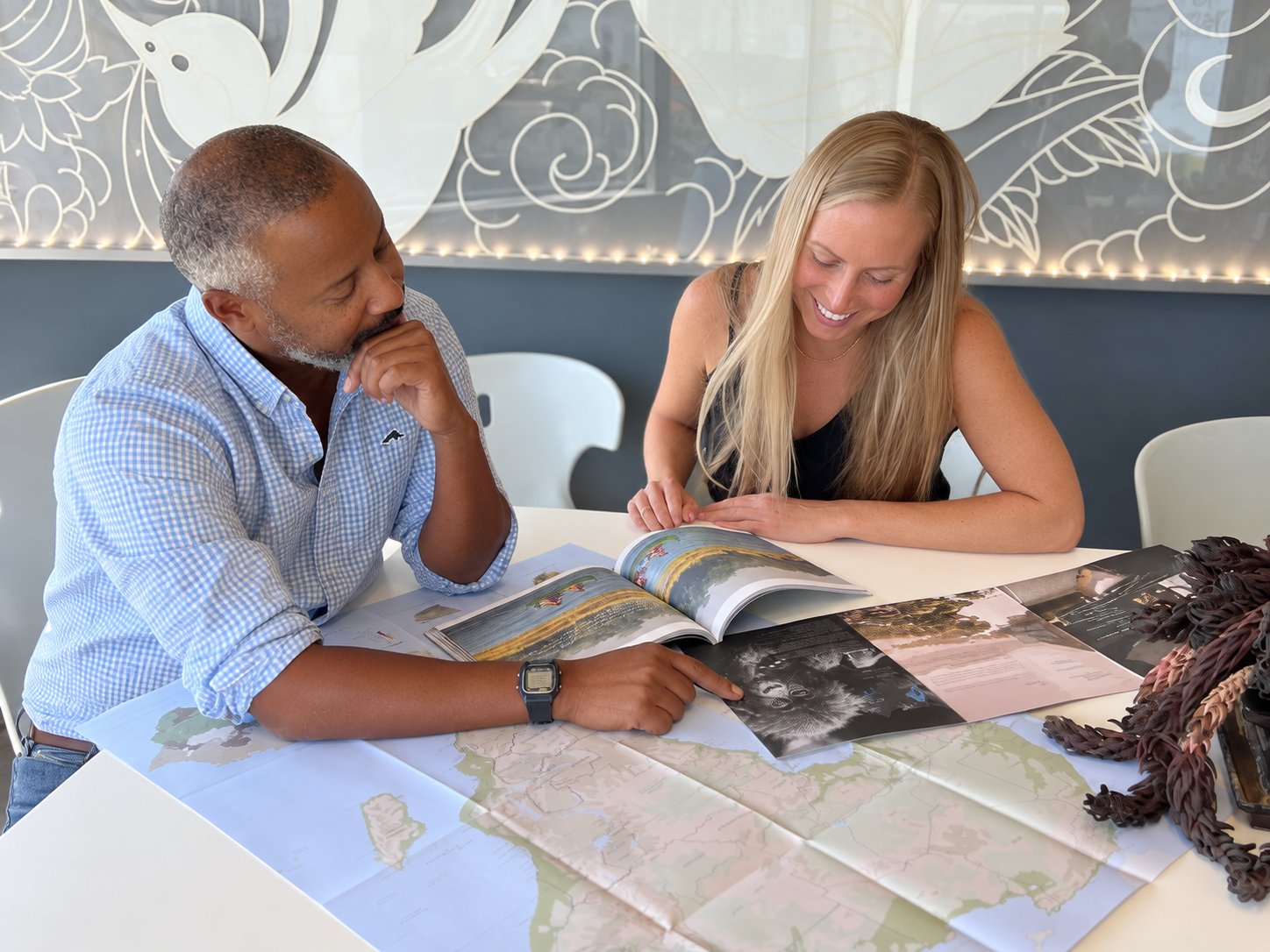 John Harvey in conversation with a client while planning an African safari